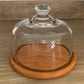 Vintage Dolphin teakwood cheese tray with heavy glass lid.